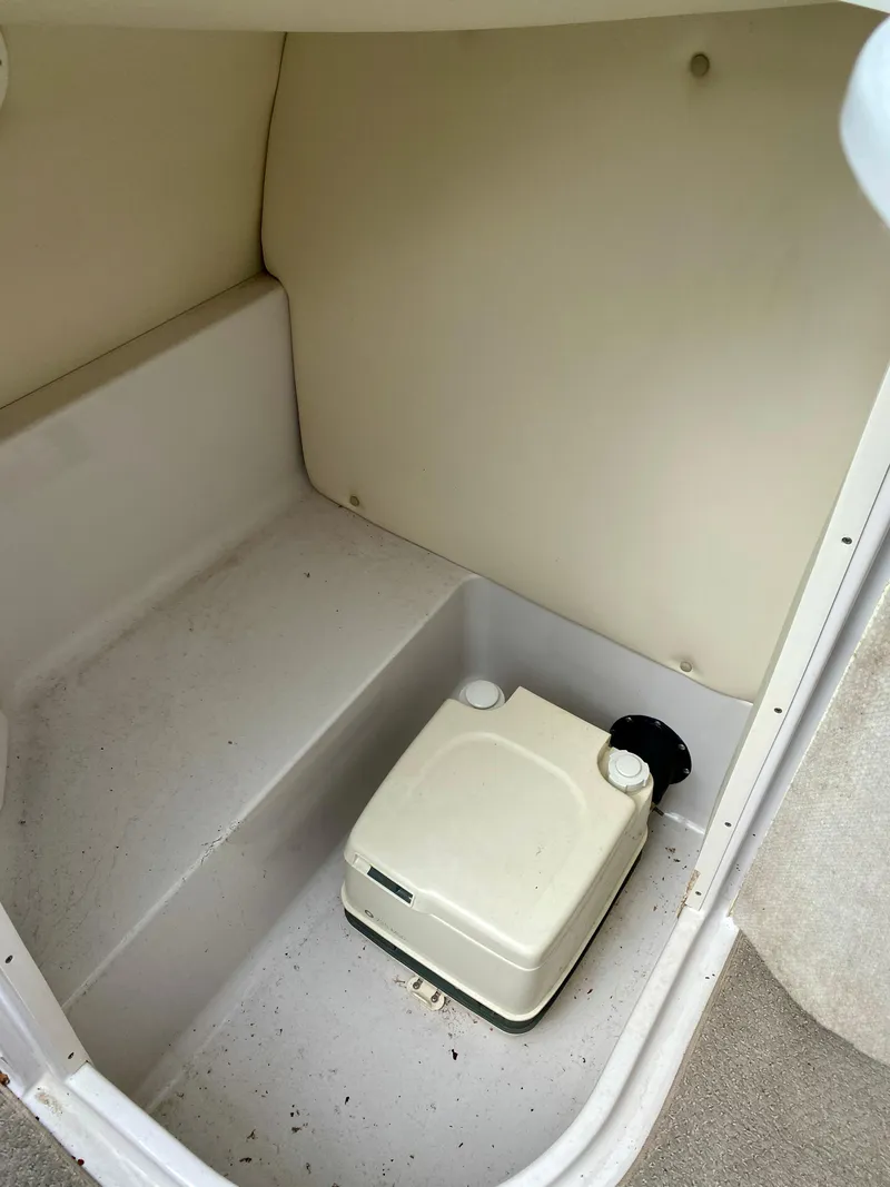 Slide: The Image of 2005 Four Winns 234 Funship boat interior with portable toilet. - 16