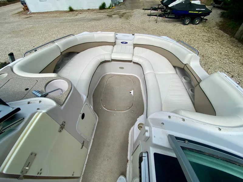 Slide: The Image of 2005 Four Winns 234 Funship boat interior with spacious seating and storage compartments. - 3
