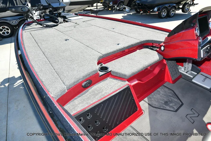 Slide: The Image of 2025 Nitro Z20 XL Pro boat interior with red accents and advanced navigation equipment. - 13