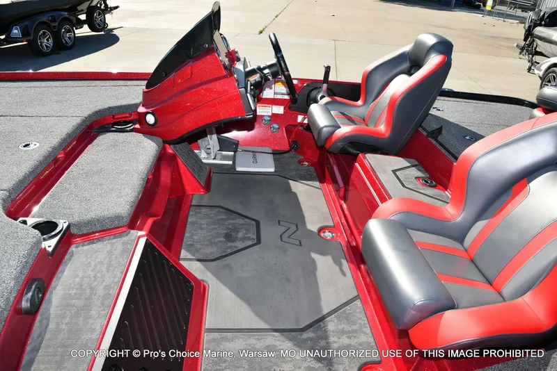 Slide: The Image of Interior of 2025 Nitro Z20 XL Pro boat with red and gray seating. - 14