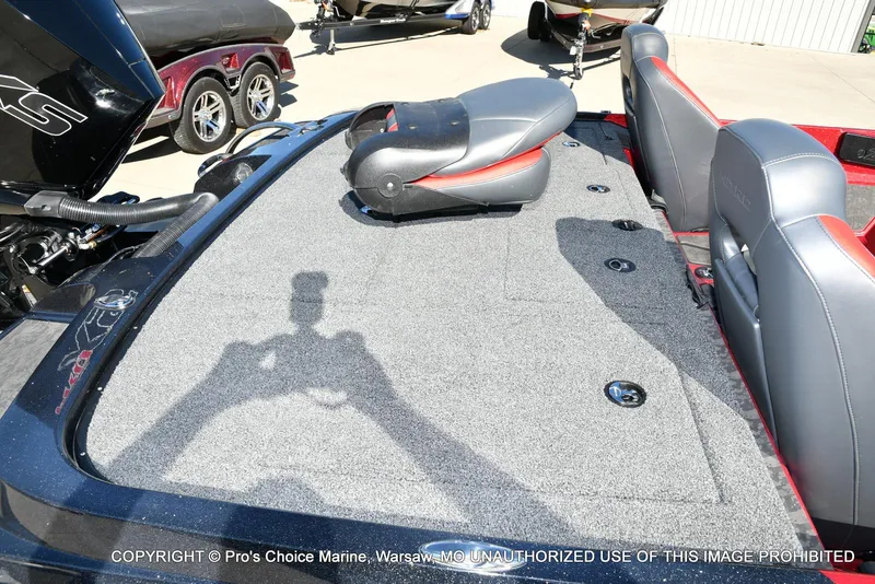 Slide: The Image of 2025 Nitro Z20 XL Pro boat interior with gray carpet and seating. - 37