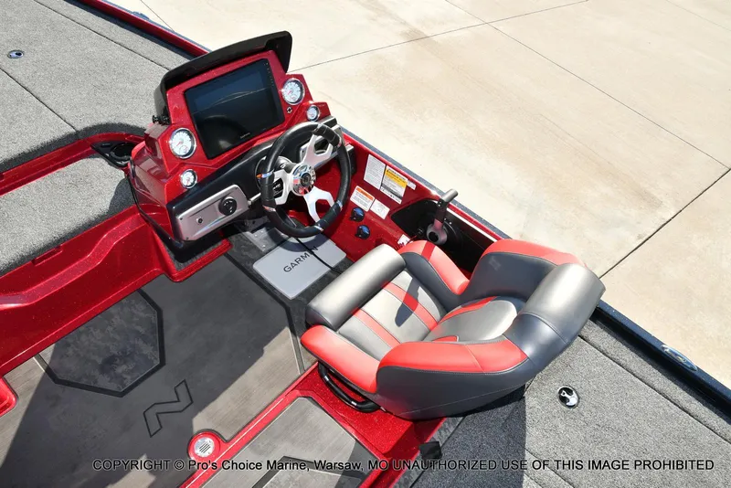 Slide: The Image of 2025 Nitro Z20 XL Pro boat cockpit with red and gray seating, steering wheel, and dashboard. - 42