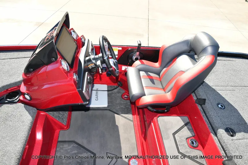 Slide: The Image of 2025 Nitro Z20 XL Pro boat interior with red and gray seating and Garmin dashboard. - 44