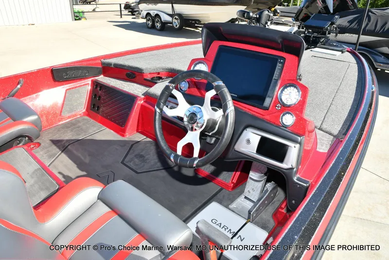 Slide: The Image of 2025 Nitro Z20 XL Pro boat interior with steering wheel and Garmin display. - 6