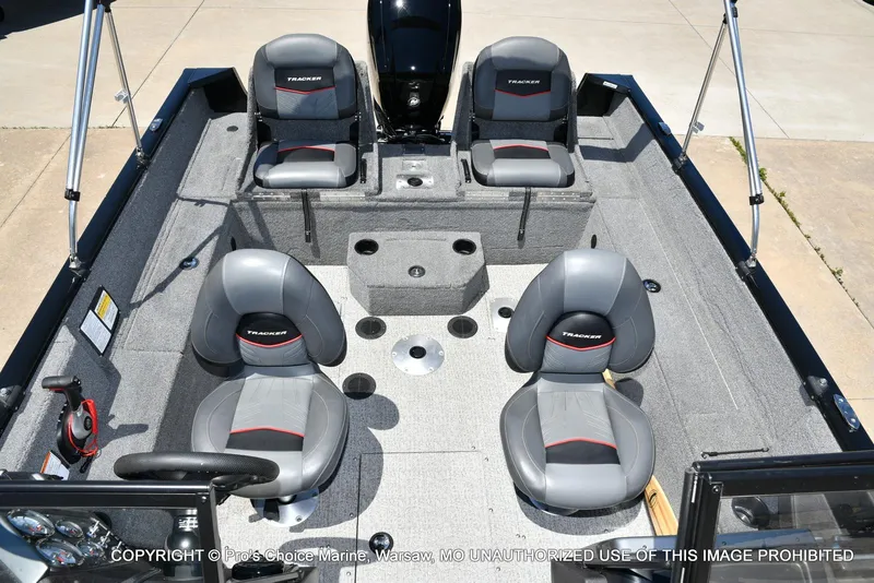 Slide: The Image of 2023 Tracker Pro Guide V-175 Combo boat interior with four seats and steering wheel. - 14
