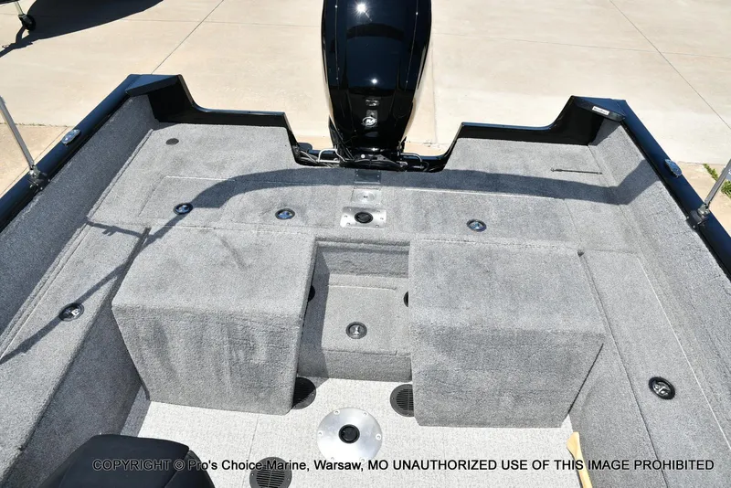 Slide: The Image of 2023 Tracker Pro Guide V-175 Combo boat interior with gray carpet and seating. - 15