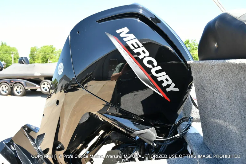 Slide: The Image of 2023 Tracker Pro Guide V-175 Combo with Mercury outboard motor, parked outdoors. - 20