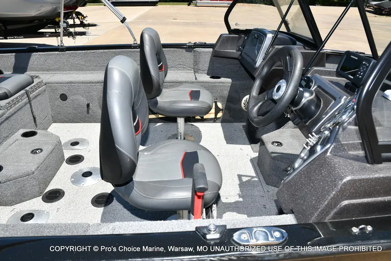 Slide: The Image of Interior of 2023 Tracker Pro Guide V-175 Combo boat with seating and steering wheel. - 35
