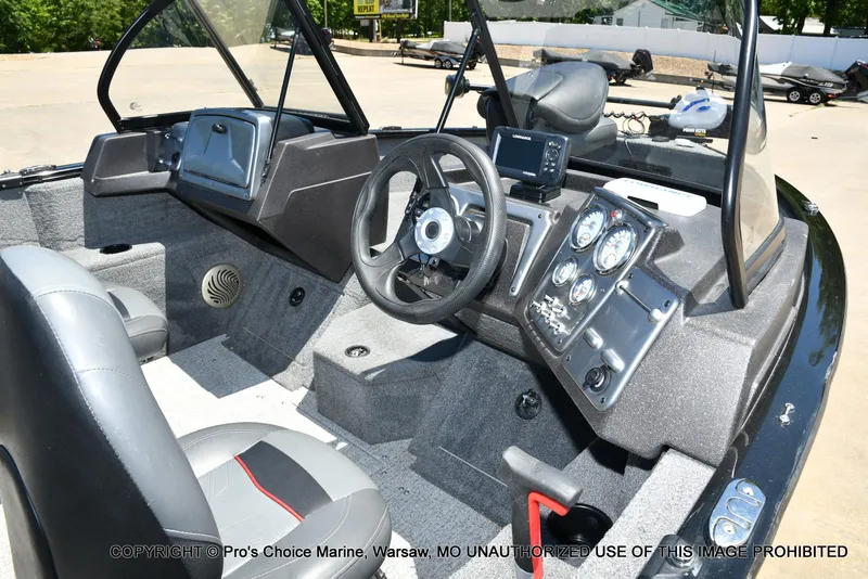 Slide: The Image of 2023 Tracker Pro Guide V-175 Combo boat interior with steering wheel and dashboard controls. - 36