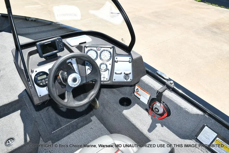 Slide: The Image of 2023 Tracker Pro Guide V-175 Combo boat dashboard with steering wheel and control panel. - 40