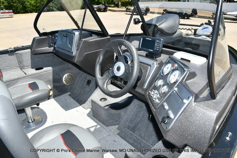 Slide: The Image of 2023 Tracker Pro Guide V-175 Combo boat interior with steering wheel and control panel. - 6