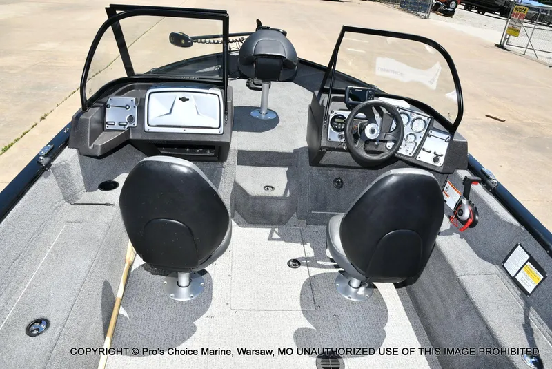 Slide: The Image of 2023 Tracker Pro Guide V-175 Combo boat interior with dual seats and steering console. - 8