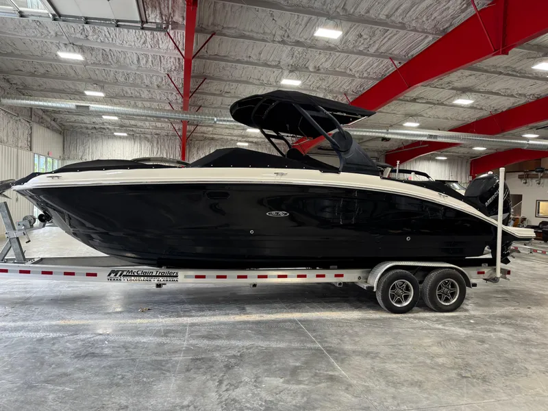 Slide: The Image of 2018 Sea Ray 270 SDX boat on trailer in indoor showroom. - 14
