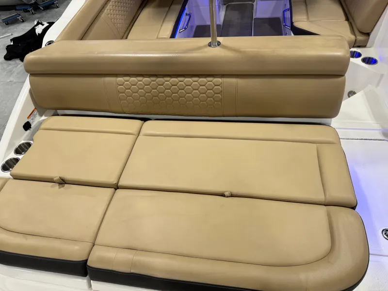 Slide: The Image of 2018 Sea Ray 270 SDX boat with tan leather seating and modern design. - 8