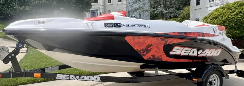 Slide: The Image of 2011 Sea-Doo 150 Speedster boat on trailer, parked outdoors. - 10