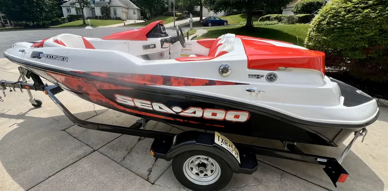 Slide: The Image of 2011 Sea-Doo 150 Speedster boat on trailer, parked in driveway. - 12