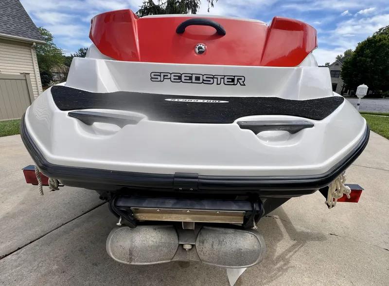 Slide: The Image of 2011 Sea-Doo 150 Speedster boat rear view, showcasing sleek design and branding. - 7