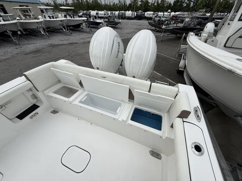 Slide: The Image of 2025 Tidewater 272 LXF boat with Seakeeper, featuring dual outboard engines and spacious deck. - 16