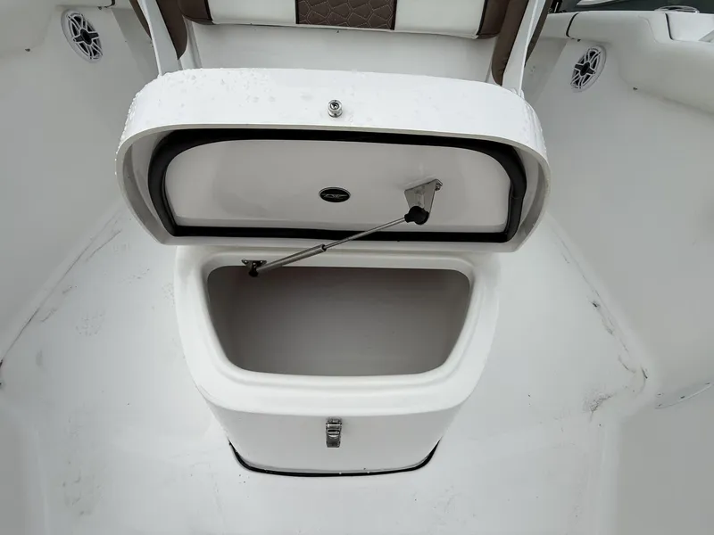 Slide: The Image of Open storage compartment on 2025 Tidewater 272 LXF boat interior. - 5