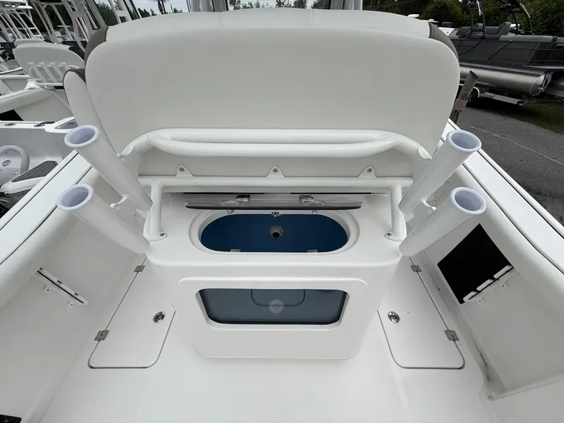 Slide: The Image of 2025 Tidewater 272 LXF boat with Seakeeper, featuring rod holders and storage compartment. - 10