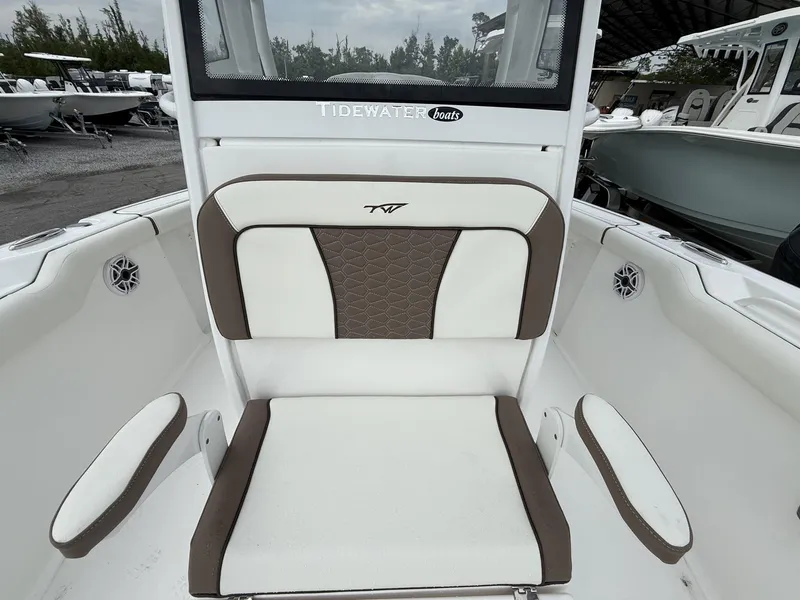 Slide: The Image of 2025 Tidewater 272 LXF boat seat with brown and white upholstery. - 4