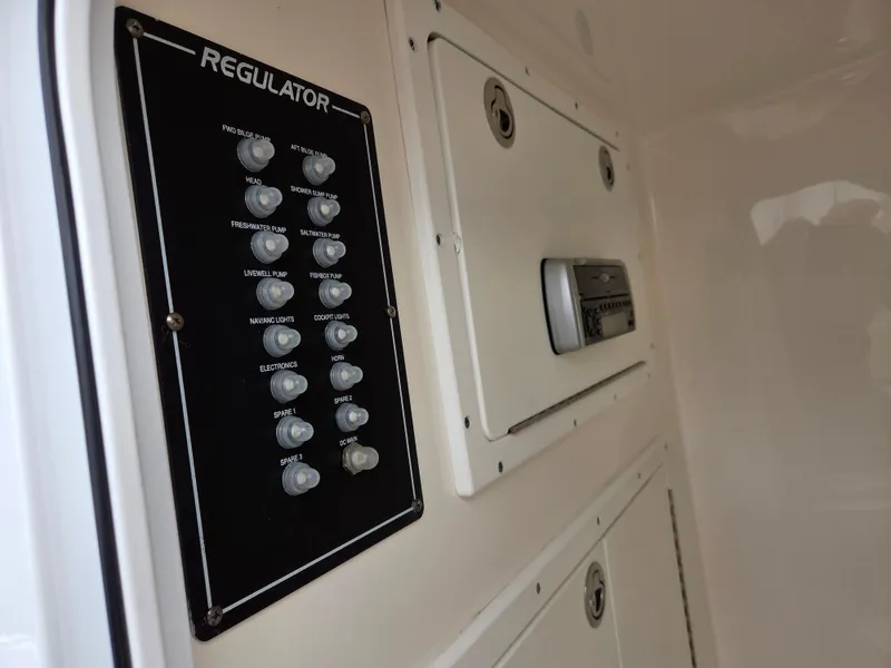 Slide: The Image of Control panel of a 2005 Regulator 32 Forward Seating boat. - 12