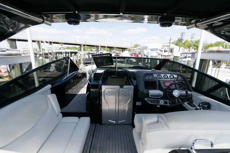 Slide: The Image of 2020 Cruisers Yachts 338 SS OB interior with modern helm and seating. - 11