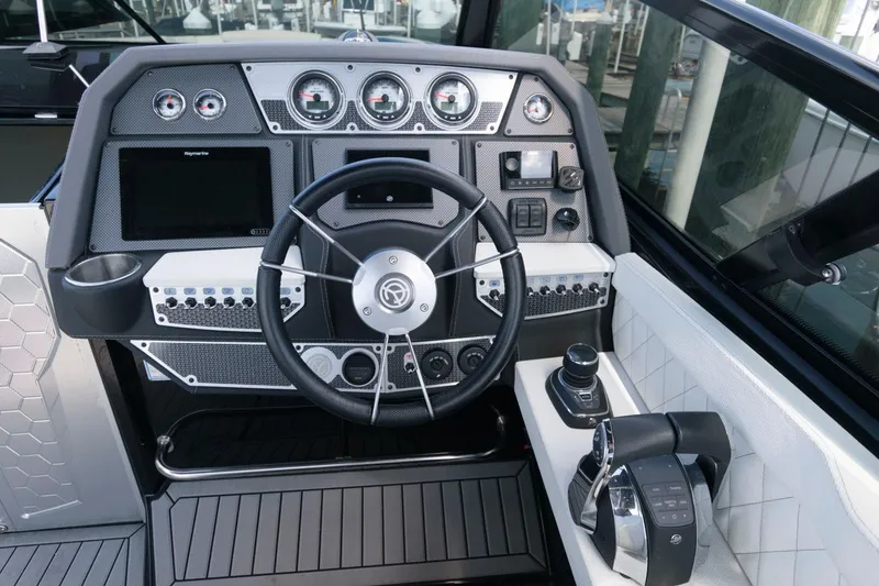 Slide: The Image of Cockpit of 2020 Cruisers Yachts 338 SS OB with modern steering and control panel. - 7