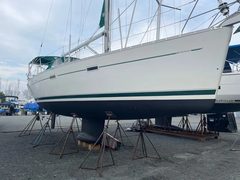 Slide: The Image of 2003 Beneteau 393 sailboat on stands in a boatyard. - 3