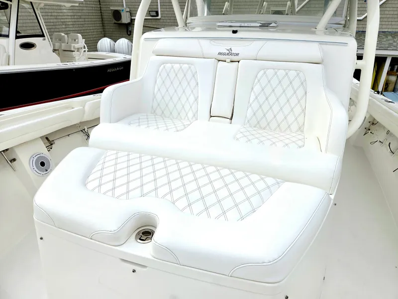 Slide: The Image of Luxurious seating on a 2017 Regulator 41 boat with diamond-stitched upholstery. - 14