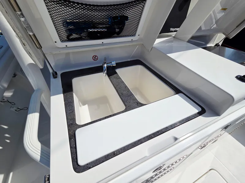 Slide: The Image of 2017 Regulator 41 boat sink with dual basins and faucet. - 22