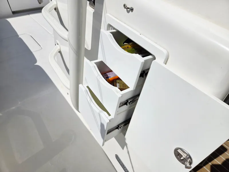 Slide: The Image of Open storage drawers on a 2017 Regulator 41 boat, showcasing organized compartments. - 24