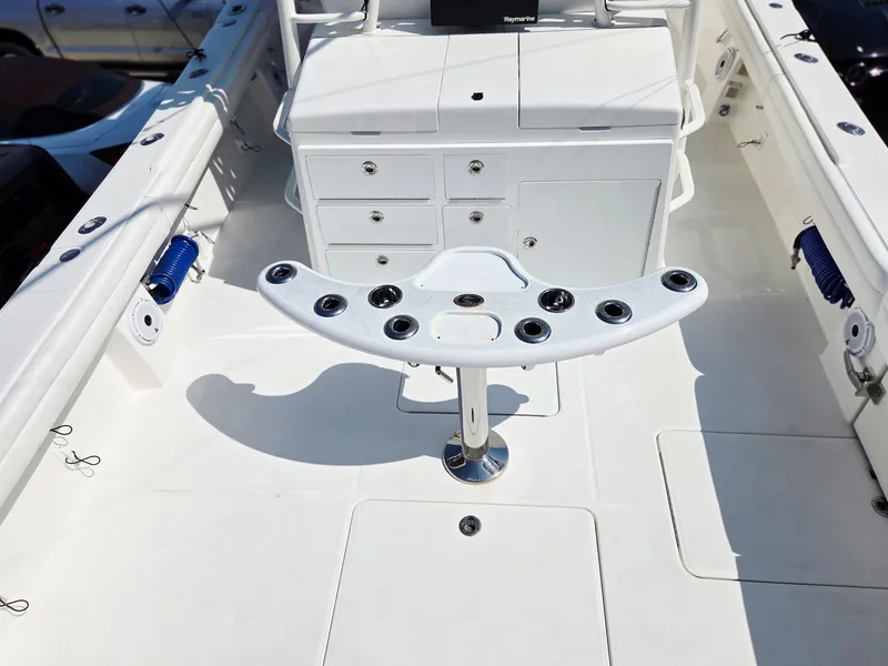 Slide: The Image of 2017 Regulator 41 boat deck with rod holders and storage compartments. - 34