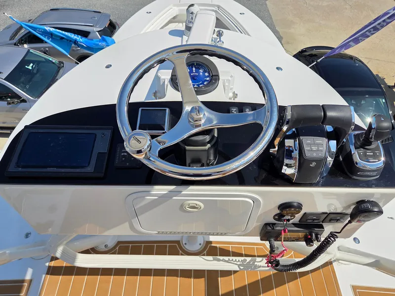 Slide: The Image of Helm of 2017 Regulator 41 boat with steering wheel and controls. - 40