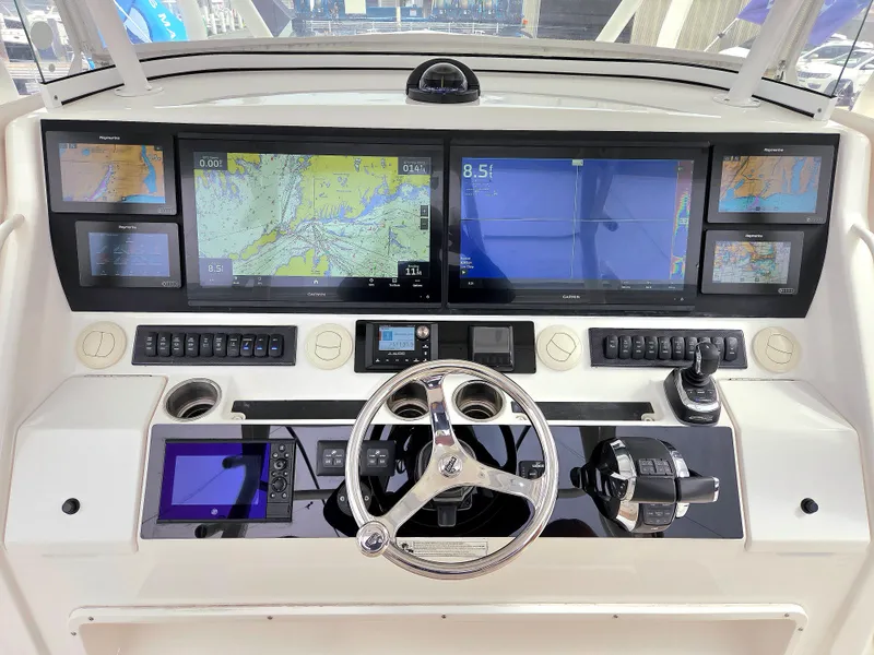 Slide: The Image of Control panel of a 2017 Regulator 41 boat with advanced navigation displays. - 8