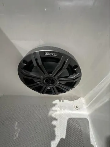 Slide: The Image of Kicker speaker installed in a 2022 Tracker T16 boat interior. - 13