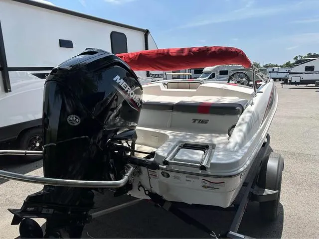 Slide: The Image of 2022 Tracker T16 boat with Mercury engine, parked near RVs. - 3