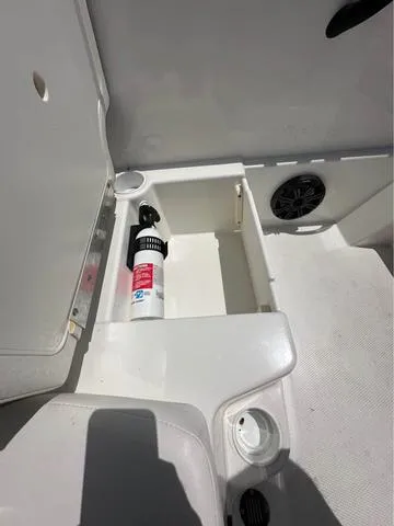 Slide: The Image of Storage compartment in a 2022 Tracker T16 boat with a fire extinguisher. - 4