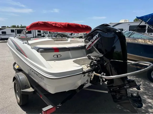 Slide: The Image of 2022 Tracker T16 boat with Mercury engine on trailer, parked outdoors. - 8