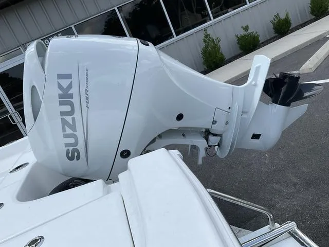 Slide: The Image of 2025 Sea Pro 172 Bay boat with Suzuki outboard motor, parked outdoors. - 3