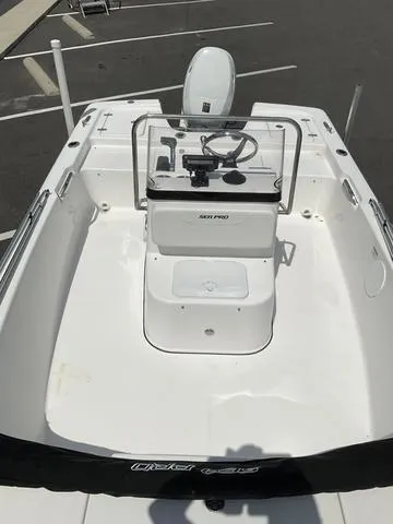 Slide: The Image of 2025 Sea Pro 172 Bay boat interior with steering console and seating. - 5