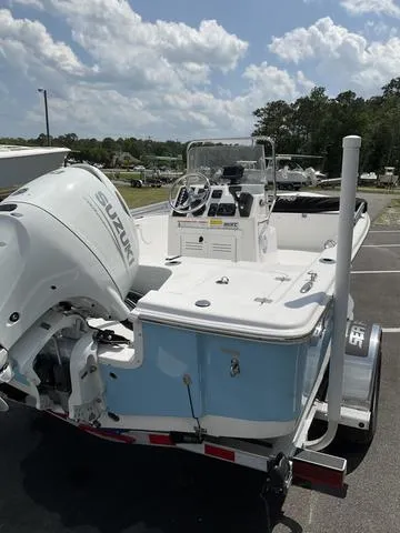 Slide: The Image of 2025 Sea Pro 172 Bay boat with Suzuki engine, parked outdoors. - 7