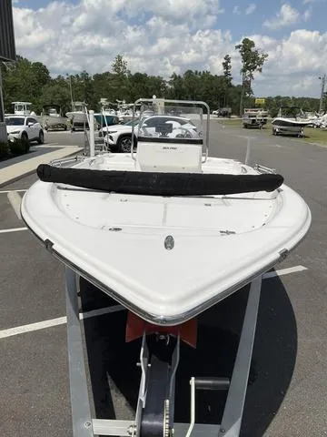 Slide: The Image of 2025 Sea Pro 172 Bay boat on trailer, parked outdoors under a cloudy sky. - 8