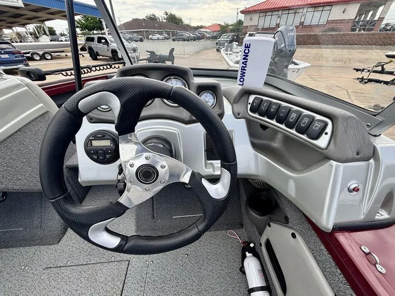 Slide: The Image of 2018 Tracker Targa™ V-18 WT boat dashboard with steering wheel and control panel. - 4