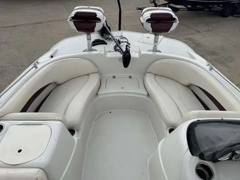 Slide: The Image of 2013 Tahoe 195 boat interior with white seating and fishing chairs. - 6
