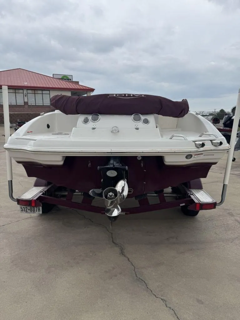 Slide: The Image of Rear view of a 2013 Tahoe 195 boat on a trailer, overcast sky. - 8