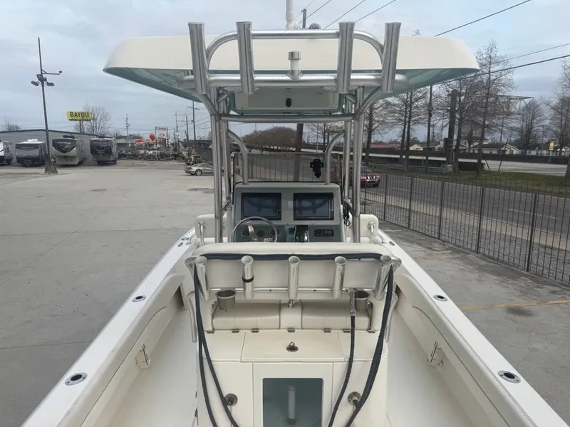 Slide: The Image of 2017 ShearWater 270 Carolina Flare boat with dual consoles and T-top in a parking lot. - 11