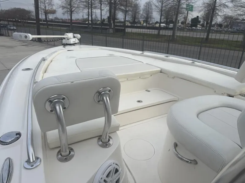 Slide: The Image of 2017 ShearWater 270 Carolina Flare boat interior with white seating and stainless steel fixtures. - 15