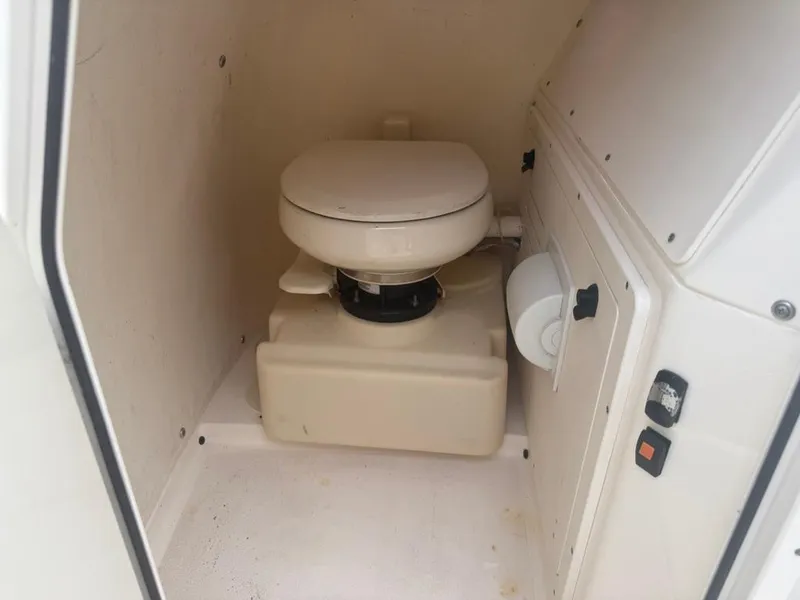 Slide: The Image of Compact marine toilet inside 2017 ShearWater 270 Carolina Flare boat cabin. - 19