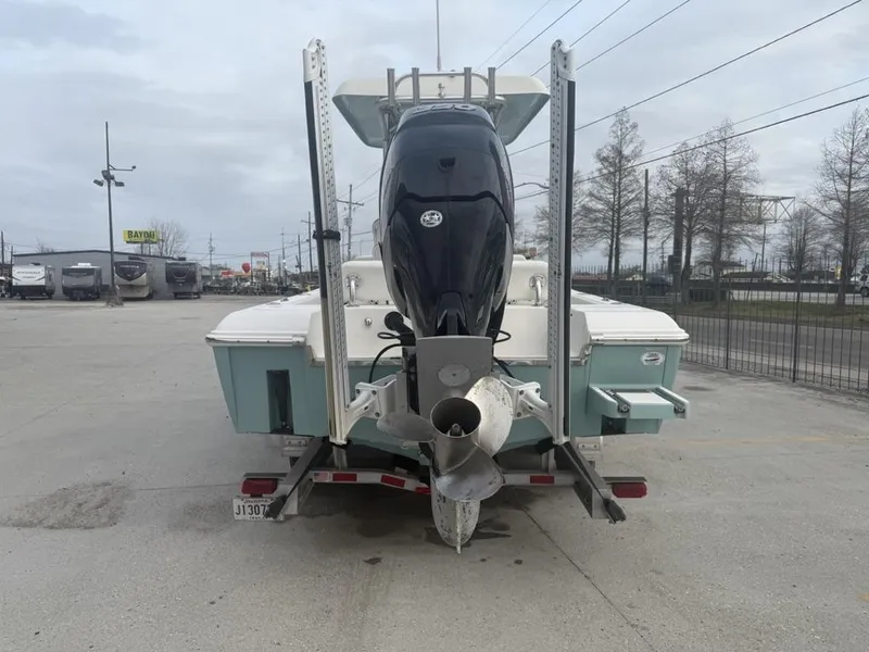 Slide: The Image of 2017 ShearWater 270 Carolina Flare boat on trailer, rear view, in parking lot. - 4